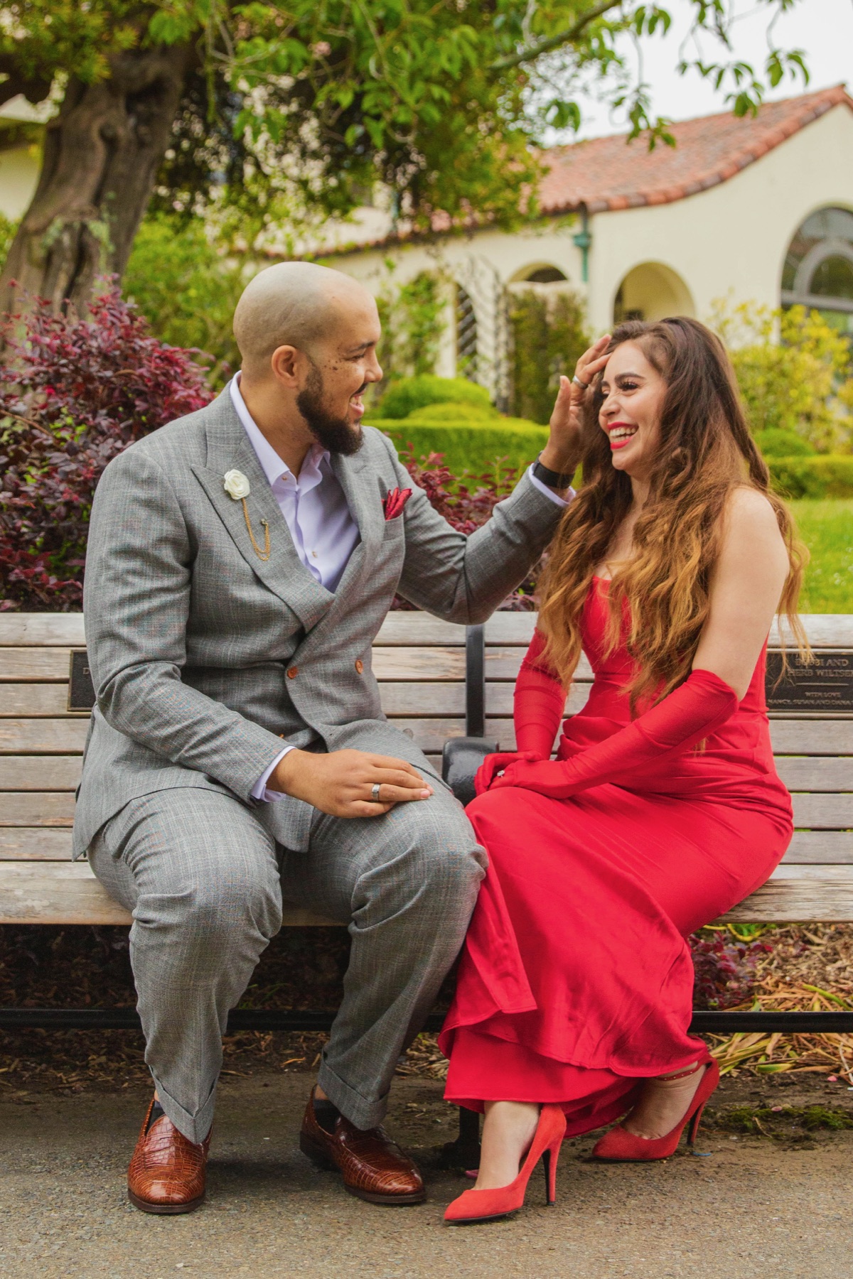 Devin and Melody seated together in a garden